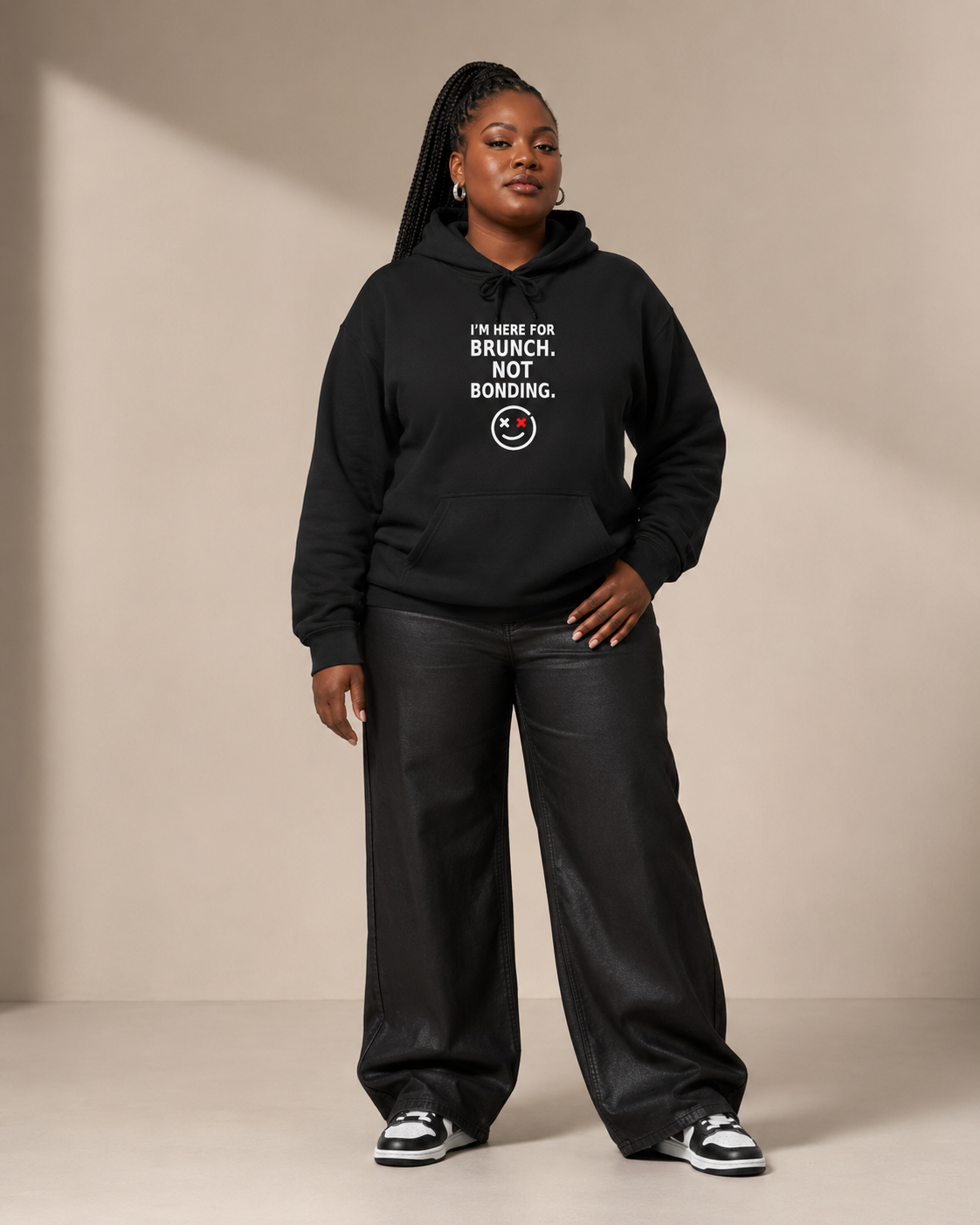 Plus-size Black woman wearing the Thread Snark I'm Here for Brunch Not Bonding black statement hoodie