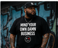 Plus-size male model wearing Thread Snark Mind Your Own Damn Business black statement T-shirt